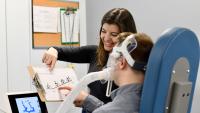 Cara H. Kanner, PT, DPT, works with study participant at the Montes Lab.